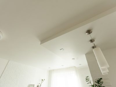 Clean gypsum board ceiling in construction site. Under construction a new house with interior modern